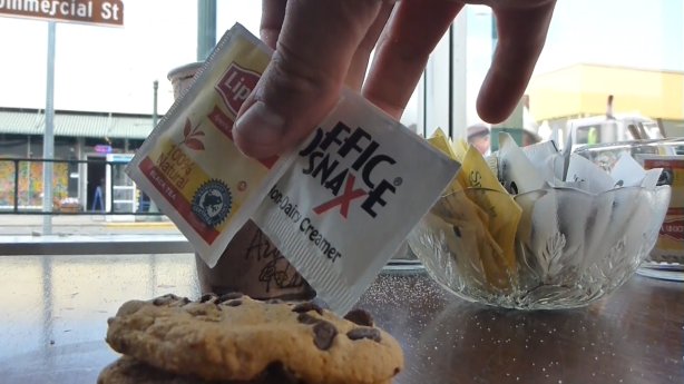 Cameron takes free food, drink, and sugar from a bank